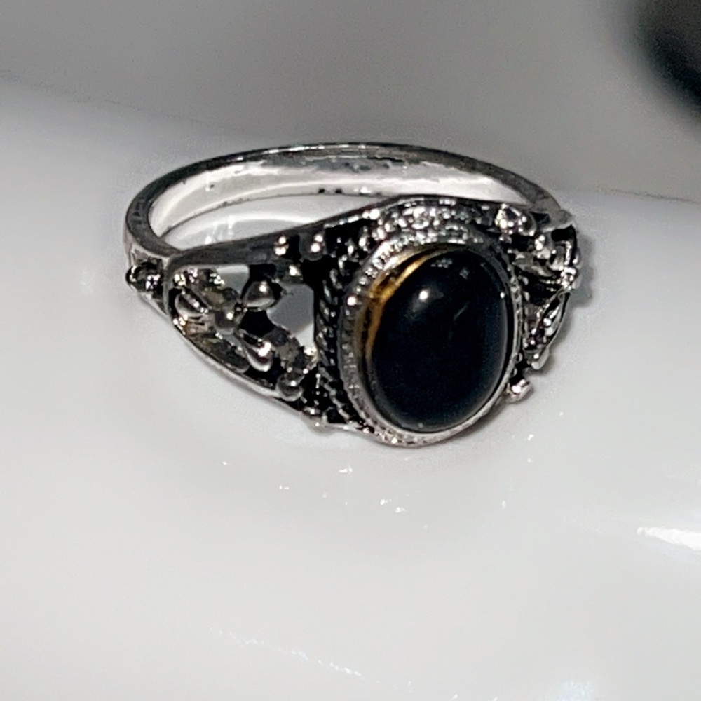 Intricate Silver Ring with Black Gemstone